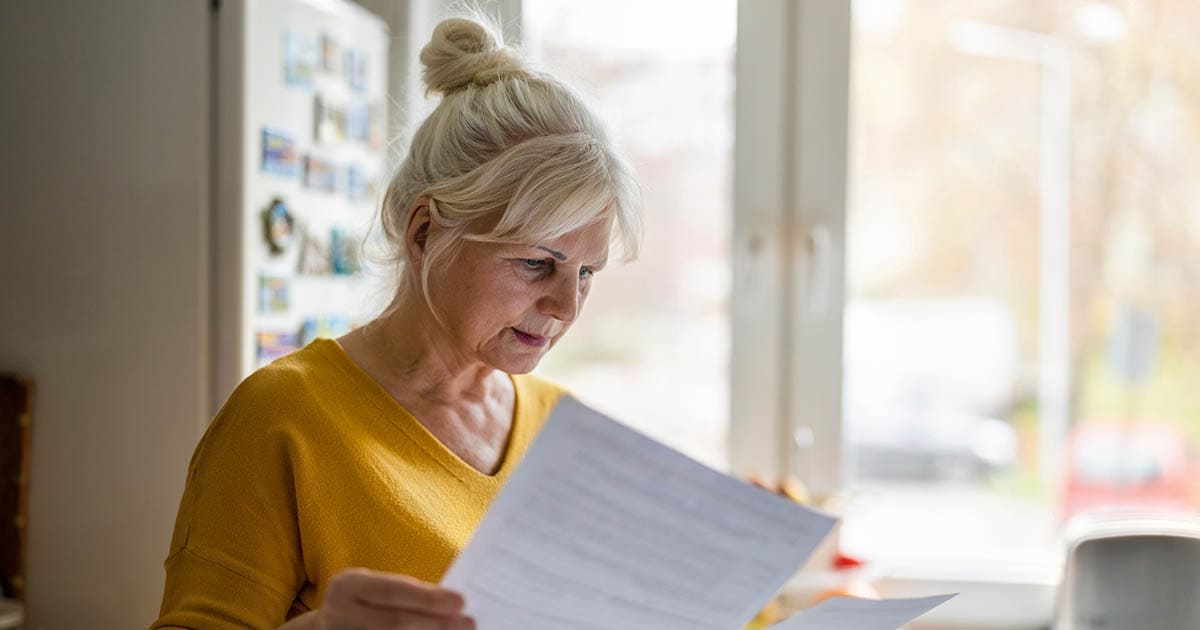 Senior looking at the paperwork