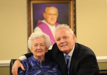 A man and an older woman posing for a photo.