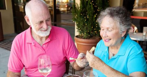 An older couple dining at an outdoor restaurant in Palm Harbor.