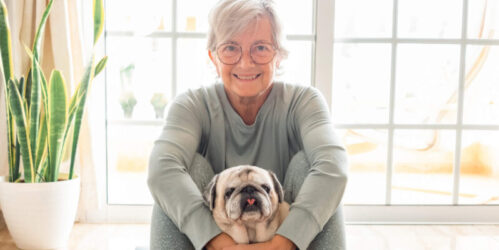 Wellness benefits of pet friendly senior living communities Older woman with dog