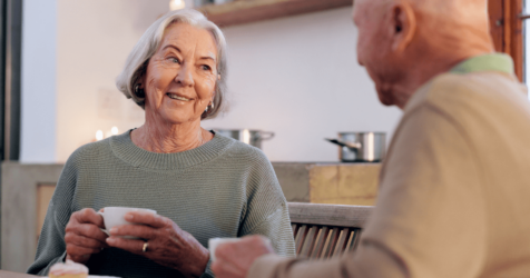 Elder couple discussing the pros and cons of senior living.