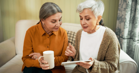 Two elder woman on a sofa discussing in senior living lifestyle is what they really want.